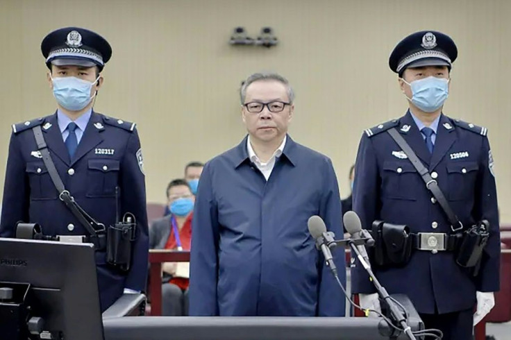 Lai Xiaomin (C) gave a detailed confession on state television last year, which showed footage of safes and cabinets stuffed with cash in an apartment allegedly belonging to him