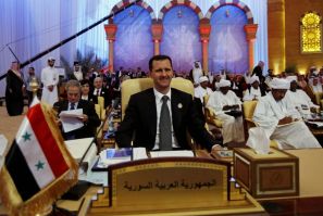 Syria&#039;s President Assad attends the final session of an Arab summit in Doha