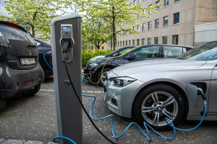 Electric cars being charged on a street in Oslo.Norway has become the first country where more than half of new cars are electrically powered