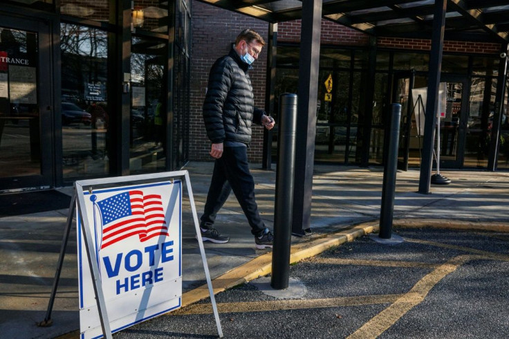 A voter leaves a polling station at the Zion Baptist Church in Marietta, Georgia