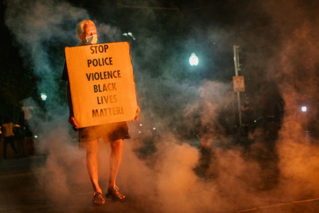 A protestor in Kenosha, Wisconsin last August after the police shooting of African American Jacob Blake.