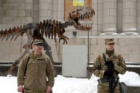 Wisconsin National Guard troops stand guard near  the Kenosha County Courthouse in preparation for possible protests over the decision not to prosecute Kenosha police officers in the August 2020 shooting of Jacob Blake.