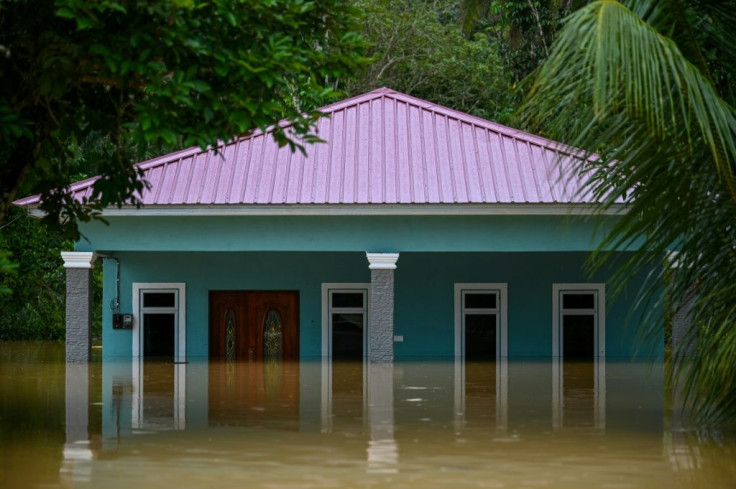 A house is seen partially submerged in Semantan in Malaysia's Pahang state