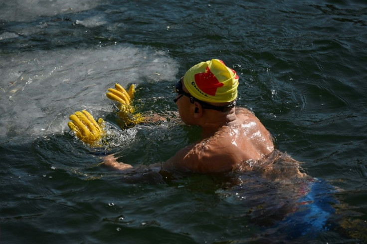 In midwinter they often have to break the ice that forms over the lake in order to make swimming lanes