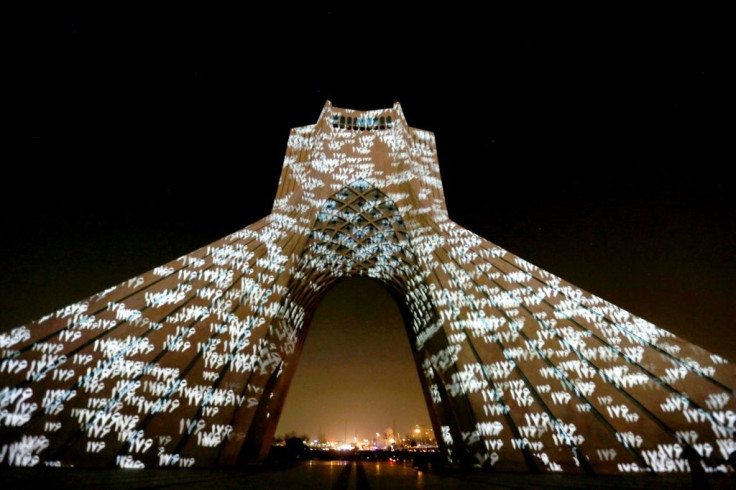 Iran's Azadi (Freedom) Tower is illuminated in honour of the victims of Ukraine International Airlines Flight 752, in Tehran