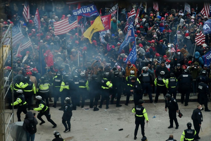 Police hold back supporters of US President Donald Trump as they gather outside the US Capitol's Rotunda