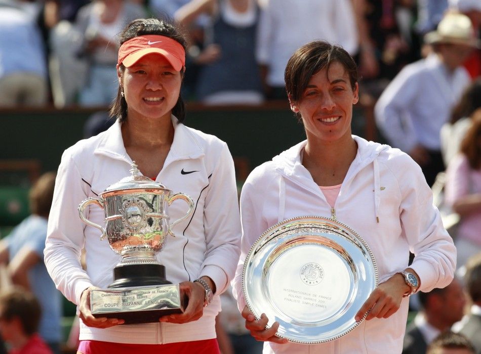 Li Na of China poses with the trophy next to Francesca Schiavone of Italy after winning the women039s final at the French Open tennis tournament.