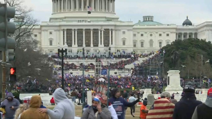 Supporters of US President Donald Trump objecting to Joe Biden's victory, storm the stairs of the US Capitol in Washington, DC.