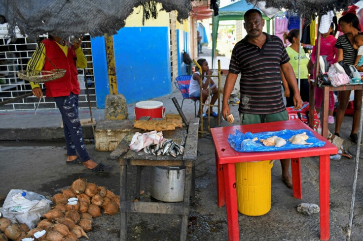 Residents and traders from the Venezuelan port town of Guiria travel to Trinidad and Tobago by boat, risking their lives, to stock up on flour, rice, oil and other essentials that have become scarce and prohibitively expensive at home