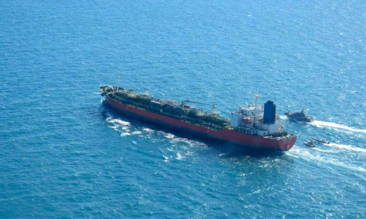 The South Korean-flagged tanker Hankuk Chemi being escorted by Iranian navy boats after being seized in the Gulf