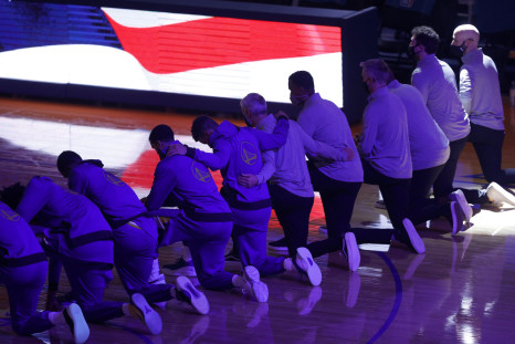 Golden State Warriors kneel for the National Anthem