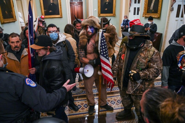 Supporters of US President Donald Trump, including men in bizarre costumes, invaded Congress