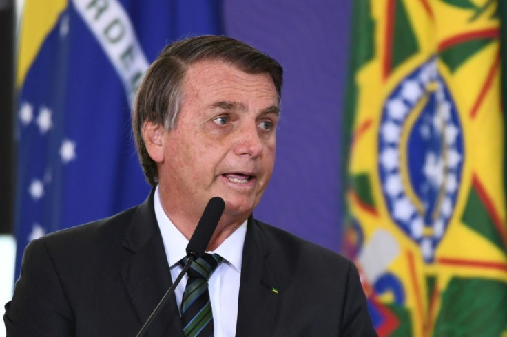 Brazilian President Jair Bolsonaro, who has said he is not likely to get a vaccine himself, delivers a speech during the launch of the  national vaccination plan against the novel coronavirus Covid-19 in Brasilia December 16, 2020