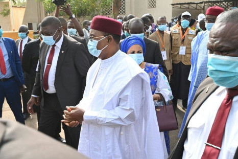 Niger's outgoing president Mahamadou Issoufou, centre, after casting his vote in the December 27 elections