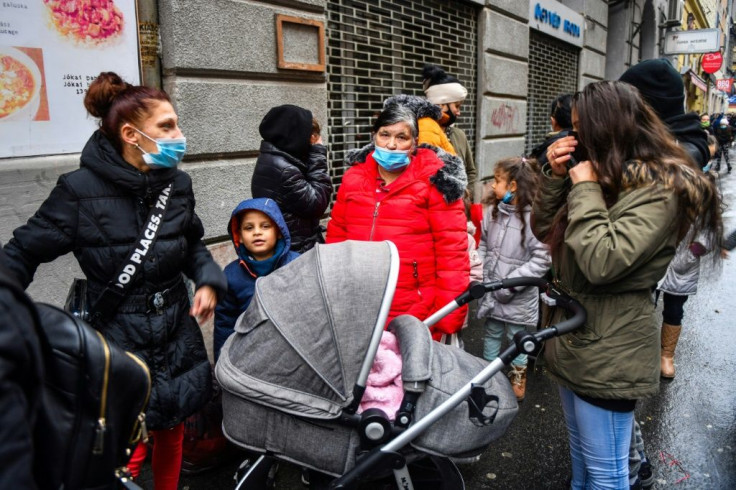 Queues for the food aid handed out at a Budapest restaurant regularly stretch hundreds of metres