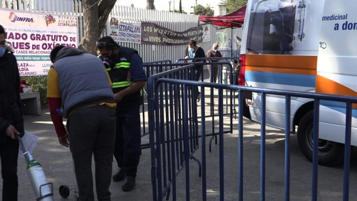 Mexico City residents, relatives of Covid-19 patients, queue for free refills of oxygen tanks offered by the local government. "I believe we also avoid crowding of the hospitals, we are helping in that way," says one local as he queues for oxygen for his