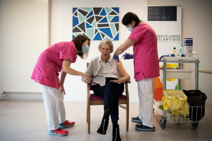 Blandine Johannel, a mursing home resident, receives a dose of the Pfizer-BioNTech Covid-19 vaccine during a vaccination campaign in Vannes, western France on January 7, 2021