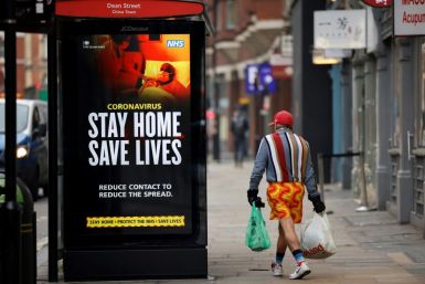 A National Health Srevice poster urges people to stay indoors where they can as the British capital endures a renewed spike in virus cases, driven by the new strain