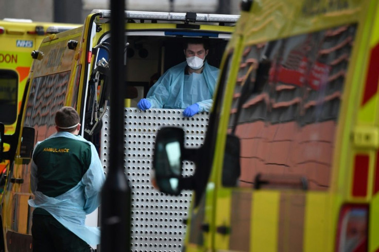 Paramedics prepare an ambulance outside the Royal London Hospital in east London amid warnings health services in the city risk being overwhelmed as infections surge