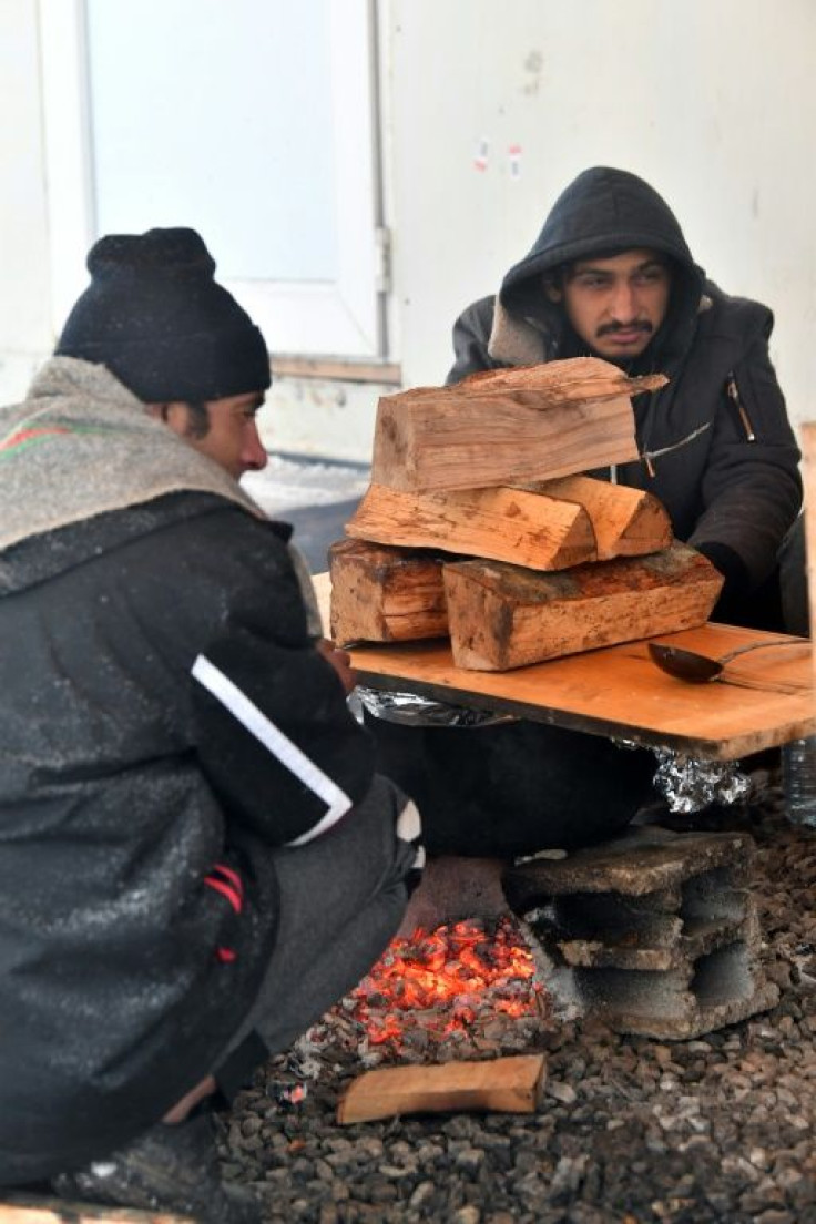 Red Cross volunteers have been providing some food to the migrants who have been sleeping rough in a nearby forest