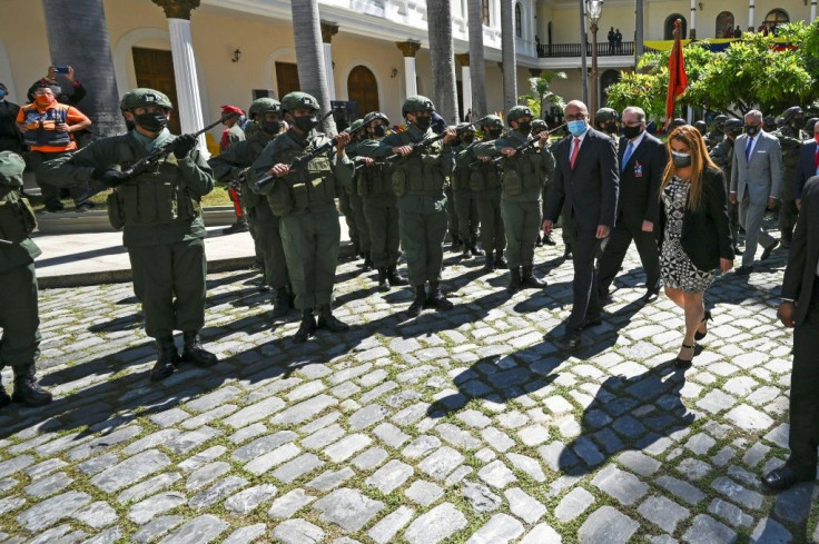 Lawmakers receive military honors after the swearing-in on January 5, 2021 of a new National Assembly in Venezuela, whose elections were criticized as unfair by the United States