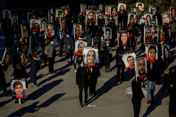 People take part in a march in memory of the victims of downed Ukraine International Airlines flight PS752, which was shot down near Tehran by Iran's Revolutionary Guard, in Toronto, Ontario, Canada, on January 8, 2021