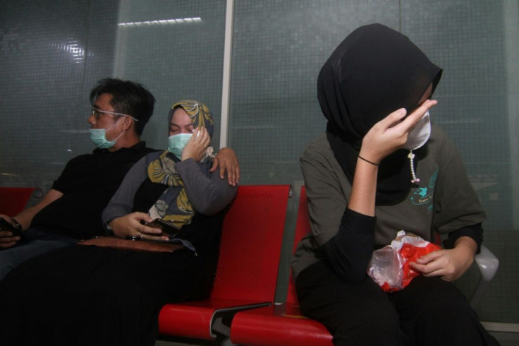 Relatives of passengers on board missing Sriwijaya Air flight SJY182 wait for news at the Supadio airport in Pontianak