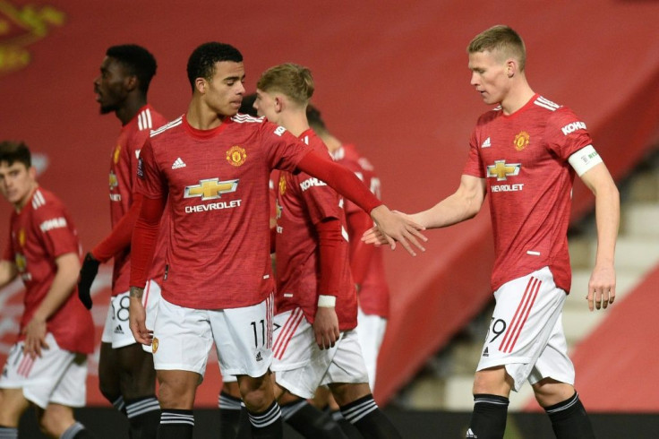 Manchester United midfielder Scott McTominay (right) celebrates after scoring against Watford in the FA Cup
