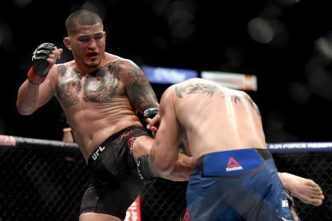 Anthony Pettis (L) of the United States kicks Donald Cerrone (R) of the United States in their Welterweight fight during UFC 249