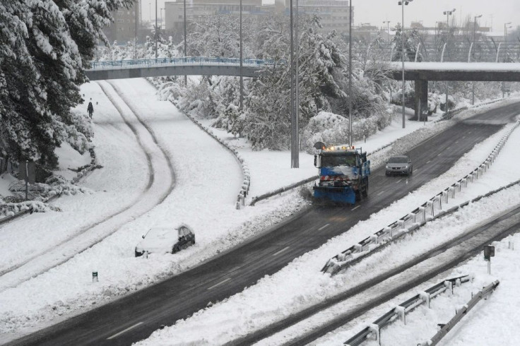 Snowploughs were out in force in and around Madrid