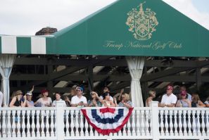 In this file photo taken on July 16, 2017, people watch as US President Donald Trump arrives at the 72nd US Women's Open Golf Championship at Trump National Golf Course in Bedminster, New Jersey