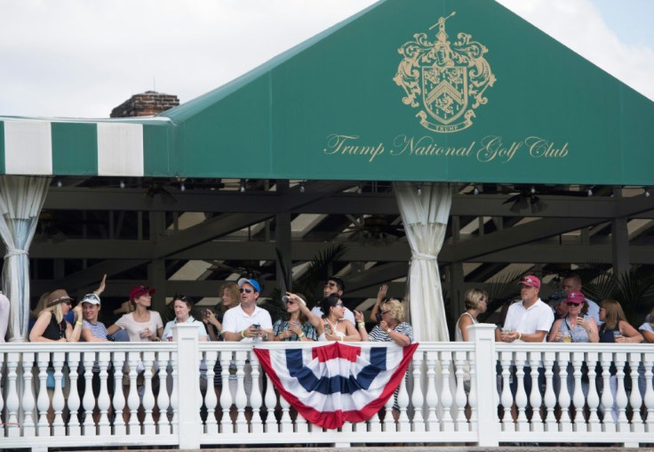 In this file photo taken on July 16, 2017, people watch as US President Donald Trump arrives at the 72nd US Women's Open Golf Championship at Trump National Golf Course in Bedminster, New Jersey