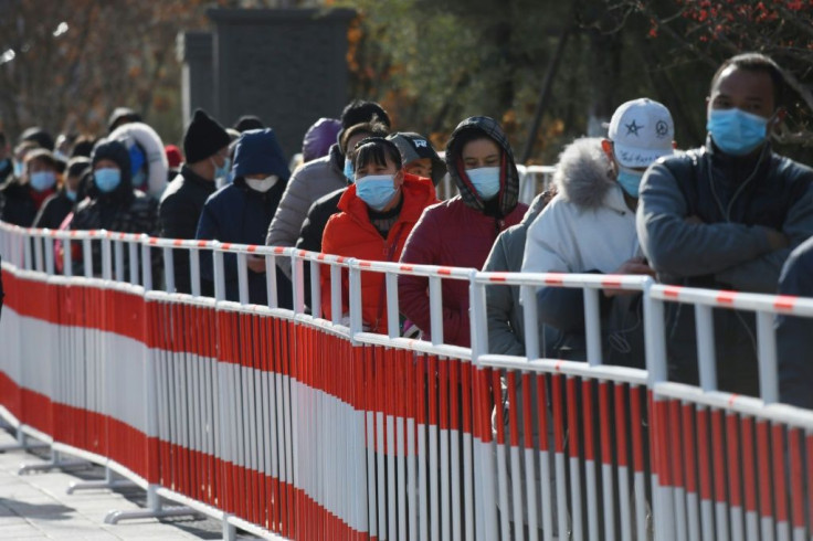 Residents line up to be tested for coronavirus in Beijing on January 11, 2021, after new cases emerged in the province which surrounds the capital