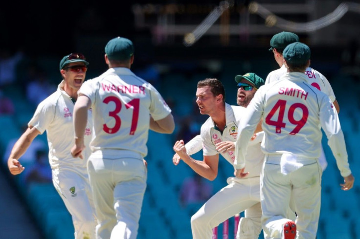 Australia's Josh Hazlewood celebrates the wicket of India's Cheteshwar Pujara