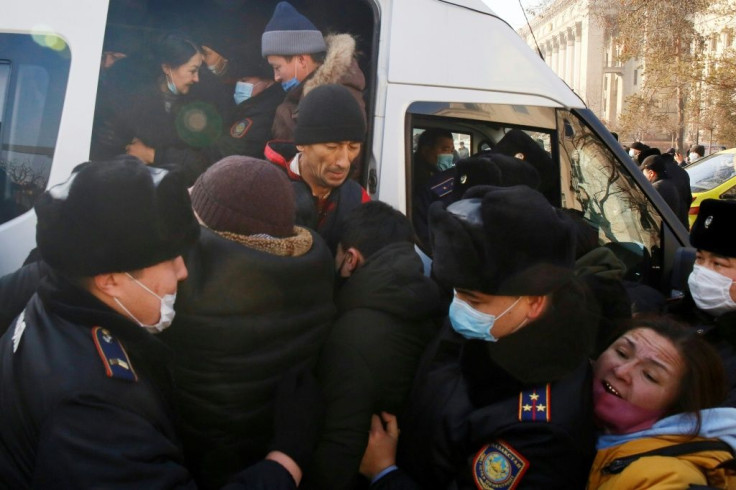 Law enforcement officers detained opposition supporters during a rally as Kazakhstan held a parliamentary election