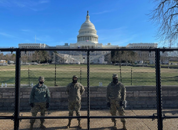 US National Guard soldiers guard the grounds of the US Capitol days after a Trump supporters stormed the building