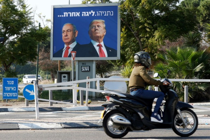 A billboard depicting Israel's Prime Minister Benjamin Netanyahu (L) and US President Donald Trump side by side with a slogan in Hebrew which reads "Netanyahu, a different league", in the Israeli coastal city of Tel Aviv