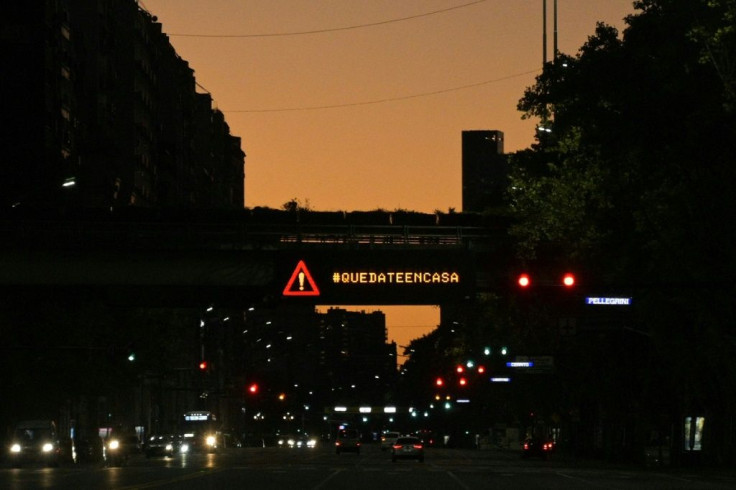 This 2020 photo shows an electric sign in Buenos Aires telling people to stay home, as the city grapples with the coronavirus