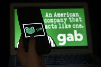 This illustration picture shows social media application logo from Gab displayed on a smart phone with its website in the background in Arlington, Virginia on January 11, 2021