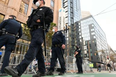 Police deployed dozens of officers and constructed security barriers outside Twitter's San Francisco headquarters, but only a few protesters and counter-protesters arrived