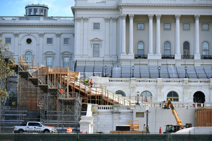 Workers construct the stage for Joe Biden's presidential inauguration at the US Capitol