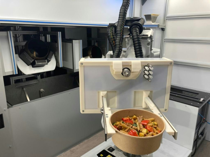 An automated kitched developed by the startup RoboEatz and launching at the 2021 Consumer Electronics Show prepares, cooks and serves an array of hot and cold food dishes from soups to salads to meal bowls