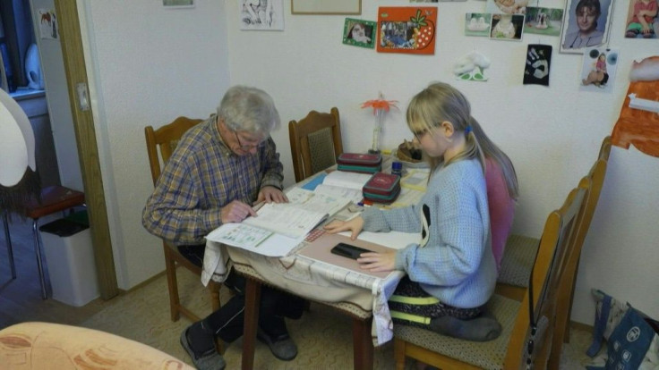 It's been a while since 81-year-old Gerd Kumbier has set foot in a classroom, but he's hitting the books once again to help home-school his great-granddaughters while the coronavirus keeps German schools closed.
