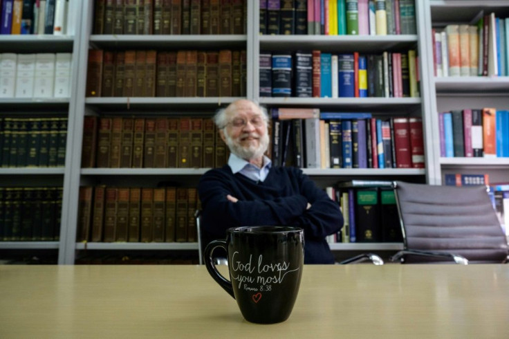 Clancey first came to Hong Kong in 1968 as a Catholic missionary priest; his office mug has a verse from the Bible written on it
