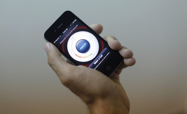 A Tawkon employee demonstrates their software on an iPhone in the basement of their offices in Herzliya