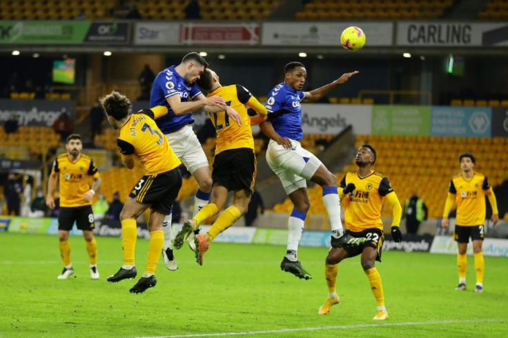 Michael Keane (second left)heads home Everton's winner to beat Wolves 2-1