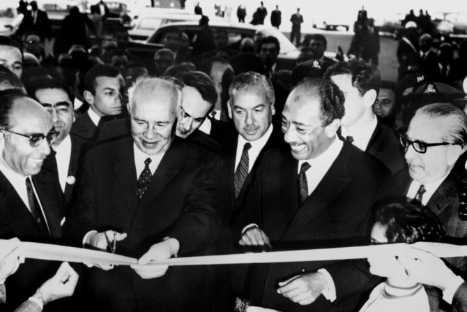 High water mark: Head of the USSR's Supreme Soviet Nikolai Podgorny cuts the ribbon alongside Egyptian President Anwar al-Sadat (2nd R) at the inauguration of the Aswan High Dam, on January 15, 1971