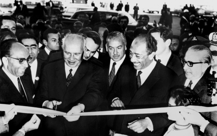 High water mark: Head of the USSR's Supreme Soviet Nikolai Podgorny cuts the ribbon alongside Egyptian President Anwar al-Sadat (2nd R) at the inauguration of the Aswan High Dam, on January 15, 1971