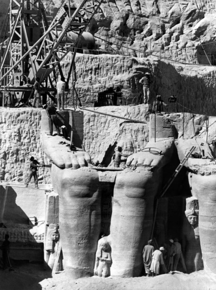 Egyptian workers dismantle a statue of Ramesses II to be moved to the new site of the twin temples of Abu Simbel in January 1966