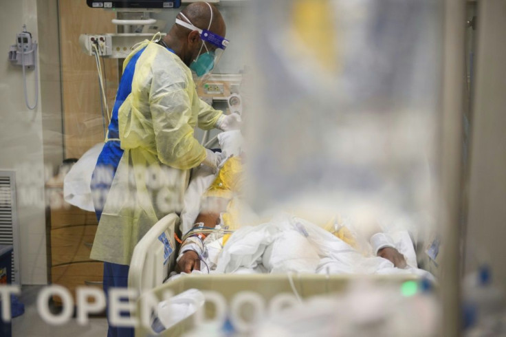 Nurses wearing personal protective equipment (PPE) attend to patients in a Covid-19 intensive care unit at Martin Luther King Jr. Community Hospital on January 6, 2021 in the Willowbrook neighborhood of Los Angeles, California